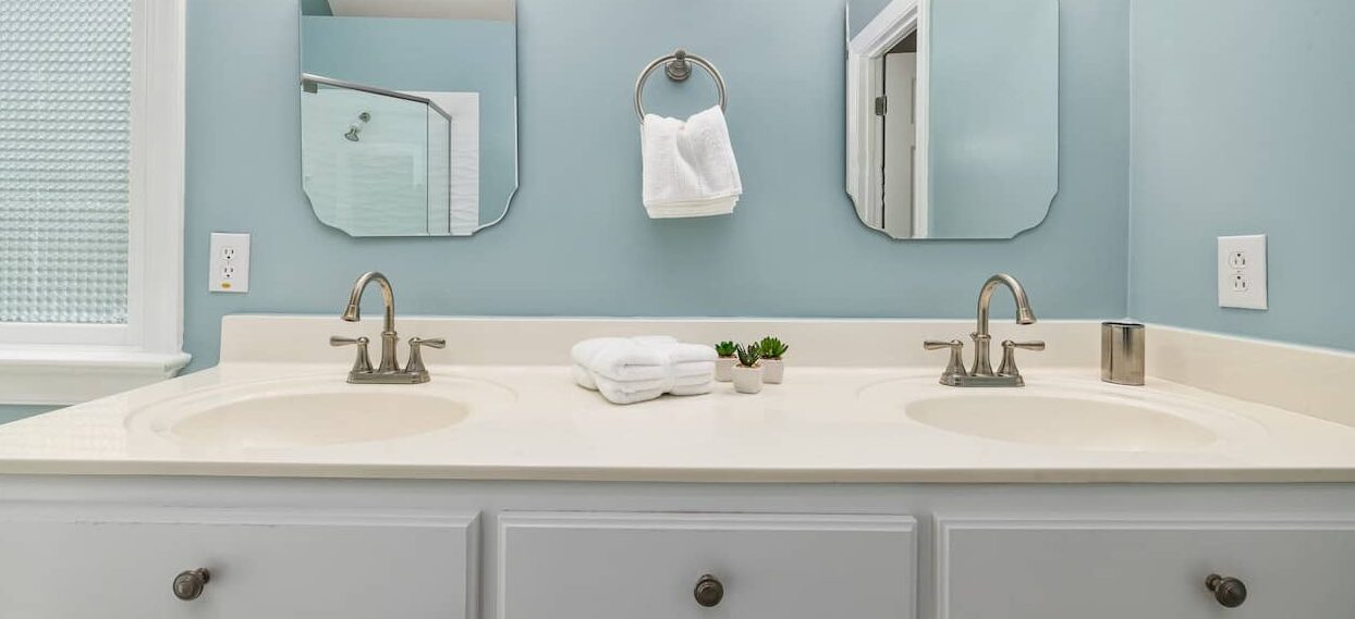 <br />
Remodeled bathroom with white sink, tub and light blue walls. Bathroom Remodeling company charlotte