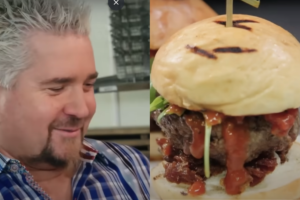 Guy Fieri Looking at burger from Heist Brewery