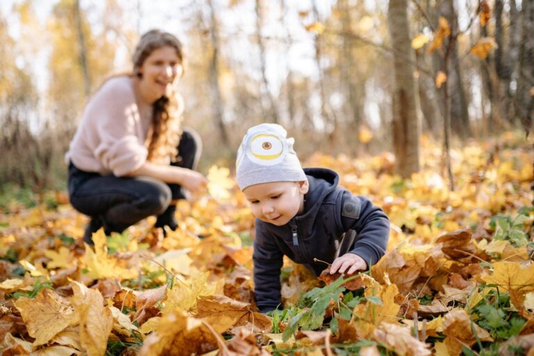 Mom and son photograph in fall forest with yellow leaves 768x512
