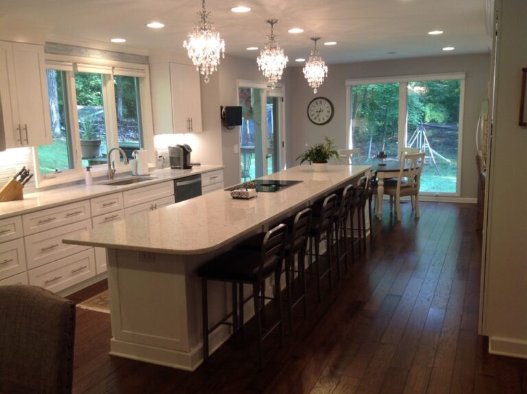 7 Day Kitchens Remodel with White Shaker Cabinets Pendant Lights and a Huge Island with Cooktop in Charlotte NC Contractor 768x574