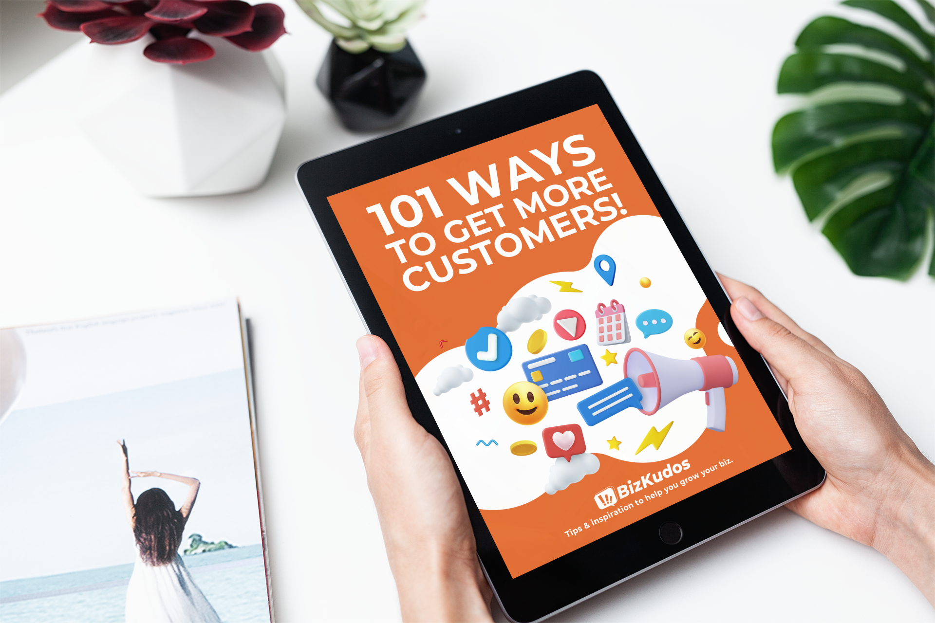 Image of person holding iPad showing ebook, 101 Ways to Get More Customers