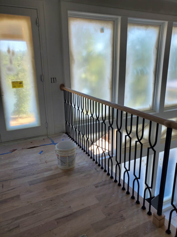 wood stair handrail installation with iron balusters charlotte