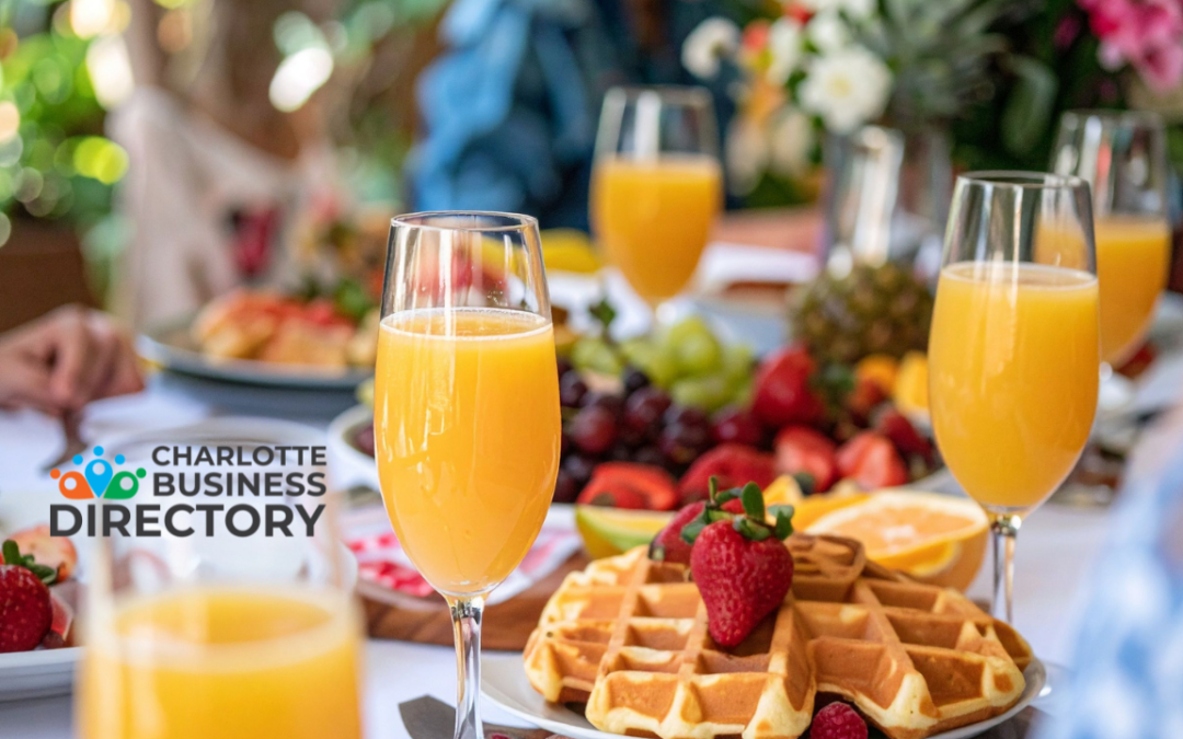 Brunch setting in Charlotte NC showing different brunch foods on table, such as orange juice, waffles and fruits.