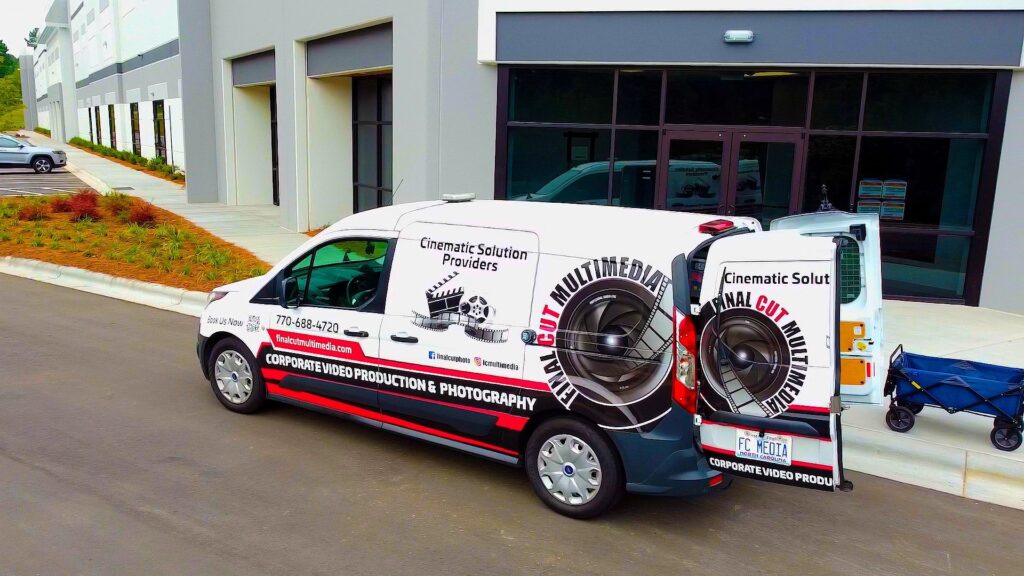 Final Cut Multimedia fully wrapped van, unloading equipment.
