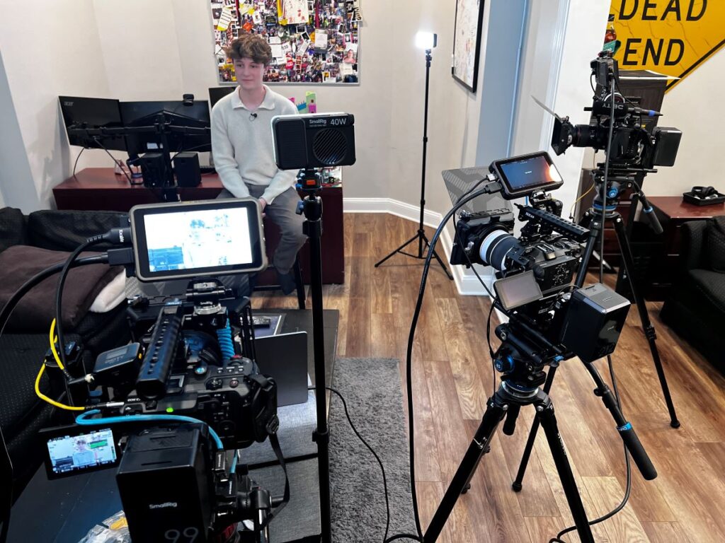Young person on set, with Final Cut Multimedia behind the scenes shot.